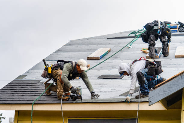 Professional Roofing technician working in East Kingston, NH